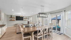 Dining space with recessed lighting, light wood-style flooring, baseboards, and a ceiling fan