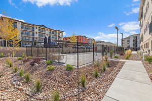 View of property's community featuring fence and a residential view