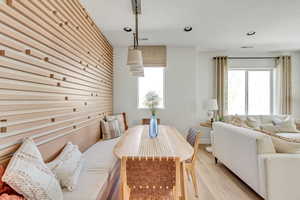 Dining space featuring a wealth of natural light, visible vents, light wood-style floors, and recessed lighting