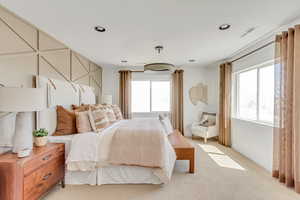 Bedroom featuring recessed lighting, visible vents, and light colored carpet