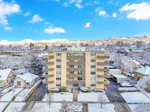 Snow covered building with a mountain view