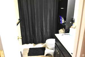 Bathroom featuring toilet and vanity
