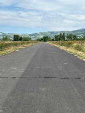 View of asphalt road featuring a mountain view