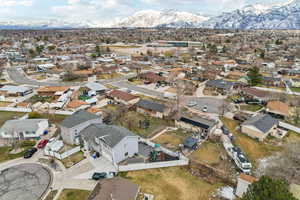 Drone / aerial view with a residential view and a mountain view