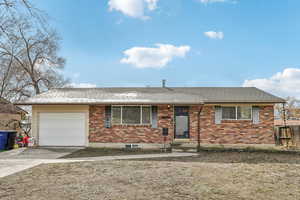 Ranch-style house with brick siding, concrete driveway, an attached garage, and a shingled roof