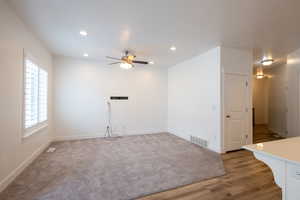Empty room featuring visible vents, recessed lighting, light wood finished floors, baseboards, and ceiling fan