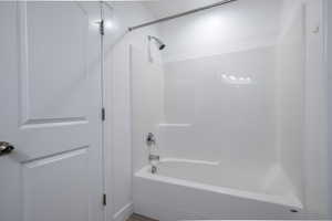 Full bathroom with shower / bathing tub combination