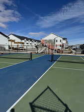 Surrounding community featuring playground community, a residential view, a tennis court, and fence