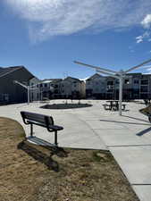 Surrounding community with a yard and a residential view