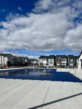 Pool with a patio and a residential view