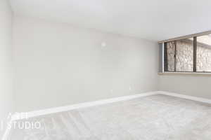 Bedroom featuring baseboards and carpet flooring