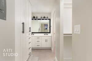 Master Bathroom featuring tile patterned floors and vanity