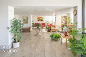 Interior space featuring a textured ceiling and wood finished floors