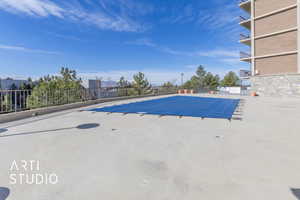 View of pool with fence