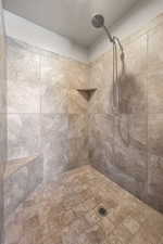 Full bathroom with a tile shower