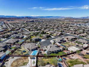 Birds eye view of property with a mountain view and a residential view