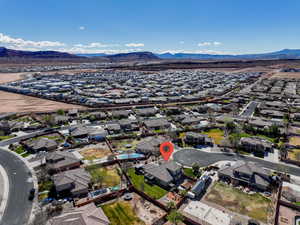 Birds eye view of property with a mountain view and a residential view