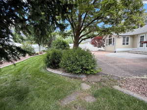 View of yard with a patio and french doors