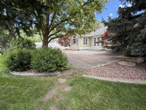 View of yard featuring french doors and a patio