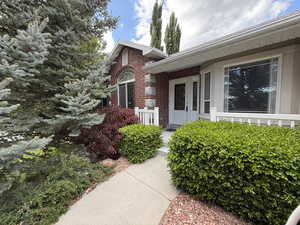 Property entrance with brick siding