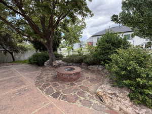 View of patio / terrace with an outdoor fire pit