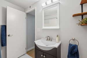 Bathroom featuring vanity and visible vents