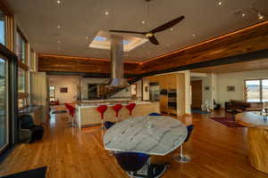 Interior space with stairs, hardwood / wood-style flooring, and ceiling fan