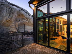 Doorway featuring floor to ceiling windows