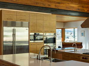 Kitchen with stainless steel appliances, modern cabinets, and a sink