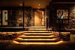 View of exterior entry with covered porch
