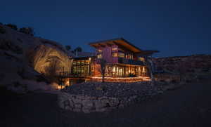 View of back of house at twilight