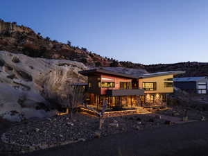 Back of house with a balcony