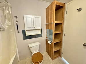 Primary bedroom en-suite. Full Bathroom. Storage shelves