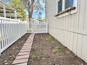 Dog run with path of pavers