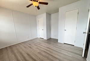 Primary Bedroom with 2 spacious closets and ceiling fan