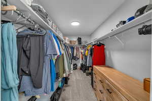 Walk in closet with carpet