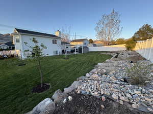 View of yard with a fenced backyard