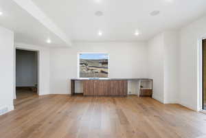 Unfurnished living room featuring light wood finished floors and recessed lighting