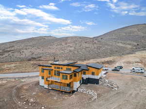 View from above of property with a mountain backdrop