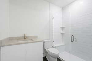 Full bath featuring vanity and a shower stall