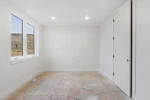 Spare room featuring recessed lighting