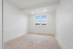 Spare room featuring recessed lighting and baseboards