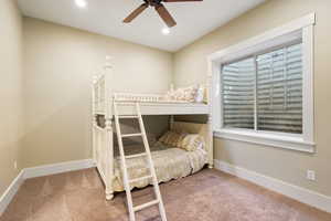 Carpeted bedroom featuring recessed lighting, baseboards, and ceiling fan