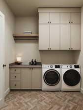 Laundry area featuring cabinet space, independent washer and dryer, and light carpet
