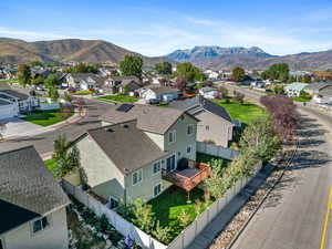 Aerial perspective of suburban area featuring a mountain backdrop