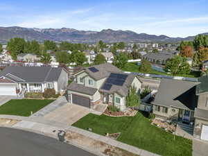 Aerial perspective of suburban area featuring a mountain backdrop