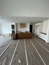 Kitchen featuring a kitchen island and white cabinetry