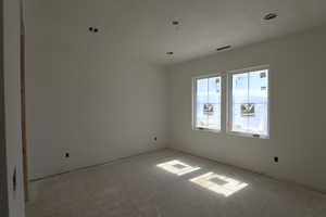 Unfurnished room featuring tile patterned floors