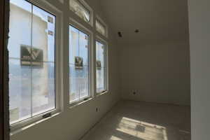 Spare room with vaulted ceiling