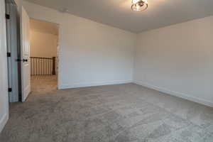 Spare room with carpet flooring and baseboards